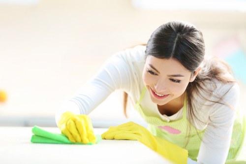 Cleaner maintaining a shared hallway in Knightsbridge