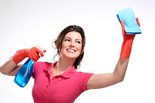 Technician checking cleaning products and safety measures